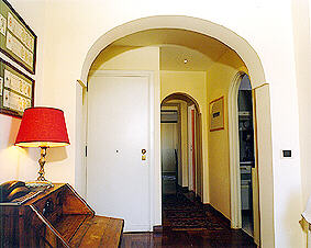 Sitting room: opposite photo of (a) showing the foyer and&nbsp; corridor